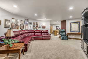 Living room featuring recessed lighting and carpet