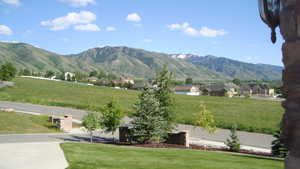 View of mountain backdrop with nearby suburban area