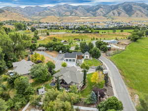 Aerial view of property and surrounding area with mountains