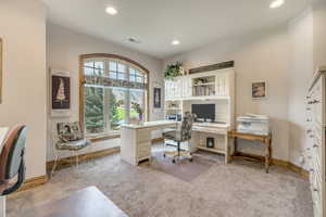 Carpeted home office featuring recessed lighting