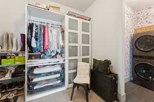 Closet featuring stacked washer / dryer