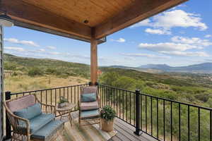 Wooden deck featuring a mountain view