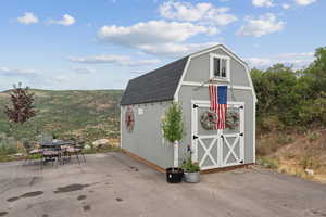 View of shed with outdoor dining space