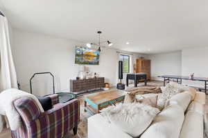 Living room with wood finished floors and recessed lighting