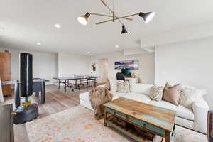 Living area with recessed lighting and wood finished floors