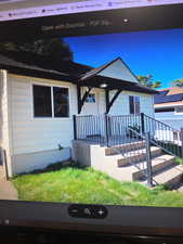 View of front of property with a front lawn