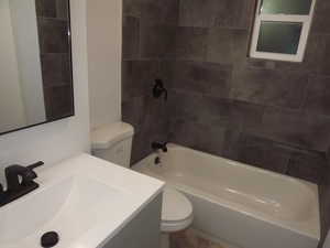 Bathroom featuring vanity and shower / tub combination
