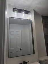 Bathroom view of toilet and vanity