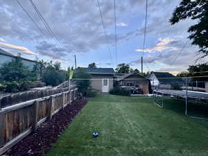 View of yard featuring a trampoline