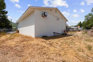 View of side of property with concrete block siding