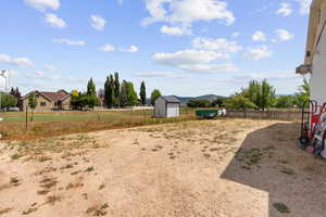 View of yard featuring a storage shed