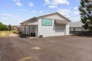 View of side of property with concrete block siding
