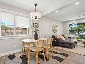 Dining space featuring wood finished floors, recessed lighting, and beamed ceiling