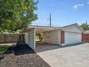 Large 2 car garage with covered storage
