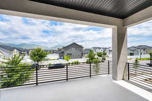 Patio / terrace featuring a residential view and a mountain view
