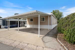 View of front of home featuring an attached carport