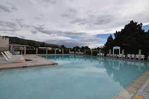 Community pool with a patio area