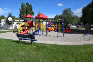 Community jungle gym featuring a yard