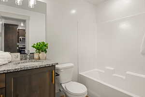 Bathroom featuring vanity and bathtub / shower combination