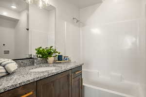 Full bathroom featuring vanity and bathtub / shower combination