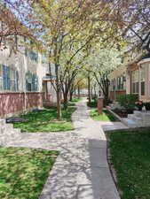 View of property's community featuring a yard