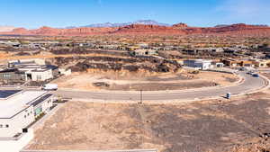 Aerial view of residential area featuring a mountainous background