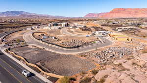 Aerial view of residential area with a mountain backdrop and a desert landscape