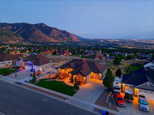 View of mountain backdrop featuring nearby suburban area