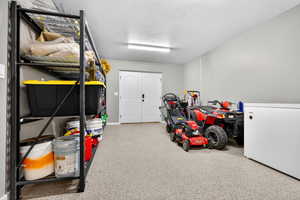 Garage featuring refrigerator