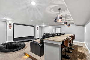 Home theater room with baseboards