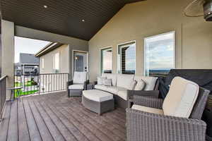 Wooden terrace with an outdoor hangout area