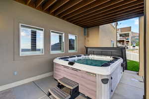 View of patio featuring a hot tub