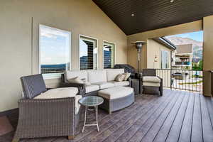 Wooden terrace featuring outdoor lounge area and a mountain view