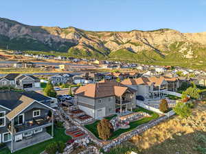 View of mountain backdrop featuring nearby suburban area