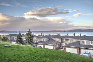 Water view featuring mountains and nearby suburban area