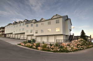 View of building exterior featuring an attached garage