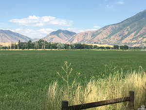 View of mountain background featuring rural landscape