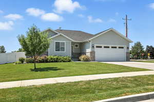 View of front of house with a garage, brick siding, concrete driveway, board and batten siding, and roof with shingles