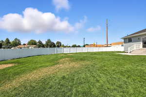 View of fenced backyard