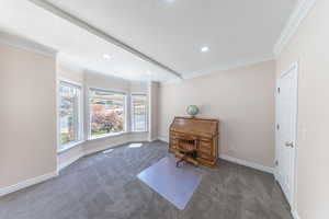 Office space with carpet flooring, recessed lighting, crown molding, and a textured ceiling