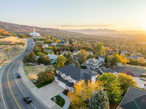 Aerial view of residential area featuring a mountainous background