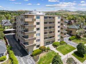 View of apartment building / complex featuring a mountain view