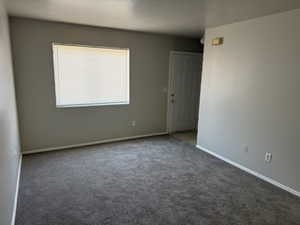 Living room with carpet and baseboards