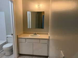 Full Bathroom with toilet and vanity