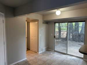 Dining Area with sliding glass door to patio.