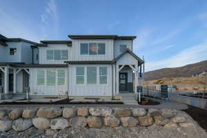 View of front of property featuring board and batten siding and a mountain view