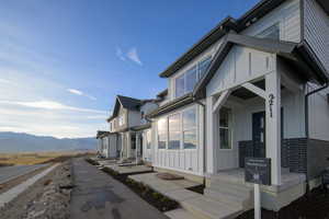 View of home's exterior with board and batten siding and a mountain view