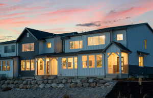 Back of house at dusk with board and batten siding