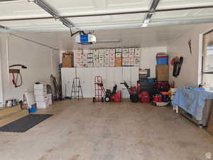 Garage featuring a garage door opener