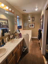 Bathroom with a bath and double vanity